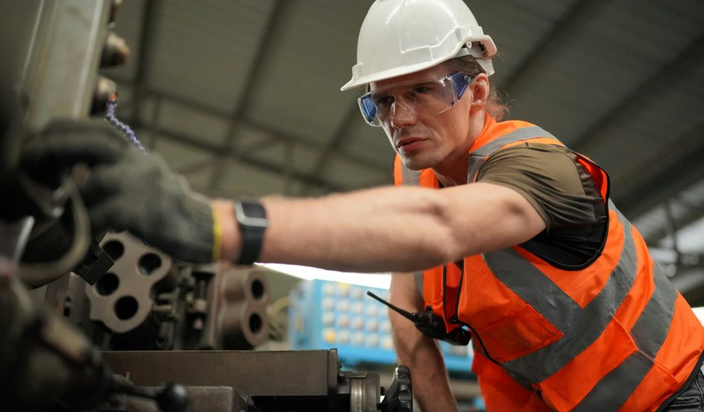 industrial factory employee working in metal manufacturing industry